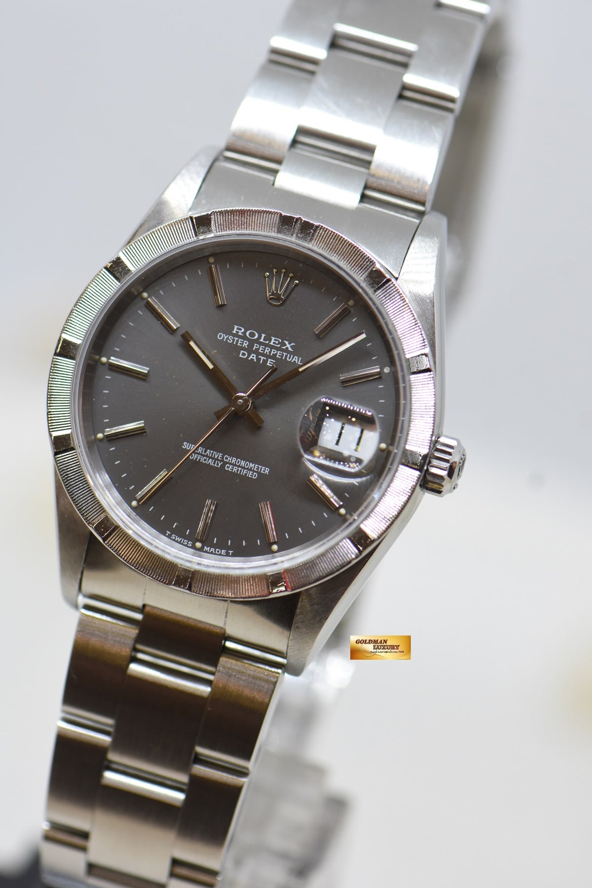 [SOLD] ROLEX OYSTER PERPETUAL DATE 34mm STEEL IN BRACELET GREY DIAL “STEEL ENGINE-TURNED” BEZEL 15210 (MINT)