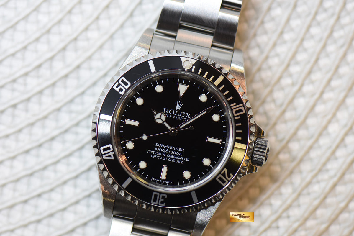 [SOLD] ROLEX OYSTER SUBMARINER NO DATE 4-LINERS 40mm STEEL BLACK 14060M (MINT)