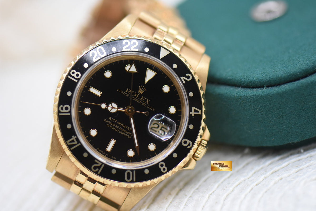 ROLEX OYSTER GMT-MASTER II YELLOW GOLD IN JUBILEE BRACELET BLACK DIAL 16718 (MINT)