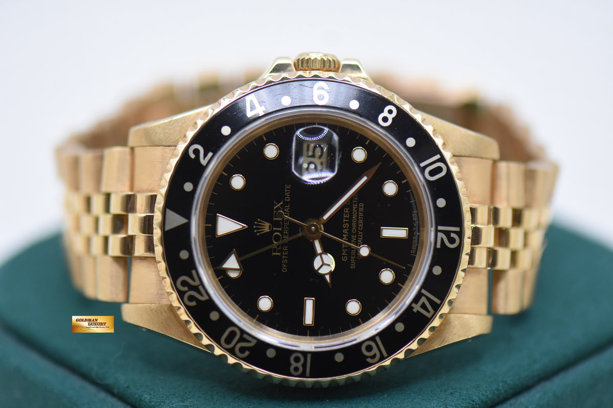 ROLEX OYSTER GMT-MASTER II YELLOW GOLD IN JUBILEE BRACELET BLACK DIAL 16718 (MINT)