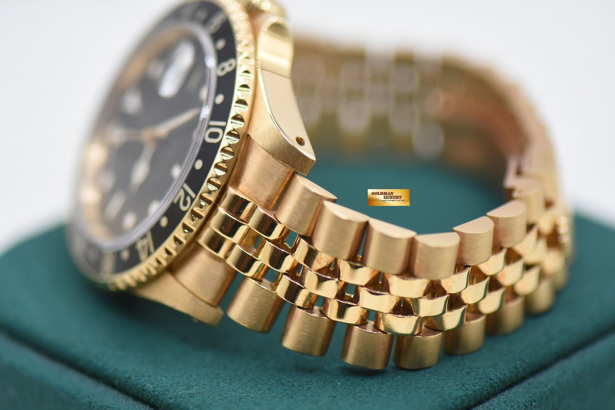 ROLEX OYSTER GMT-MASTER II YELLOW GOLD IN JUBILEE BRACELET BLACK DIAL 16718 (MINT)