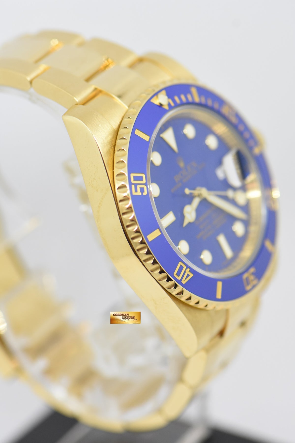 [SOLD] ROLEX OYSTER PERPETUAL SUBMARINER BLUE CERAMIC BEZEL 18K YELLOW GOLD IN BRACELET 116618LB (MINT)
