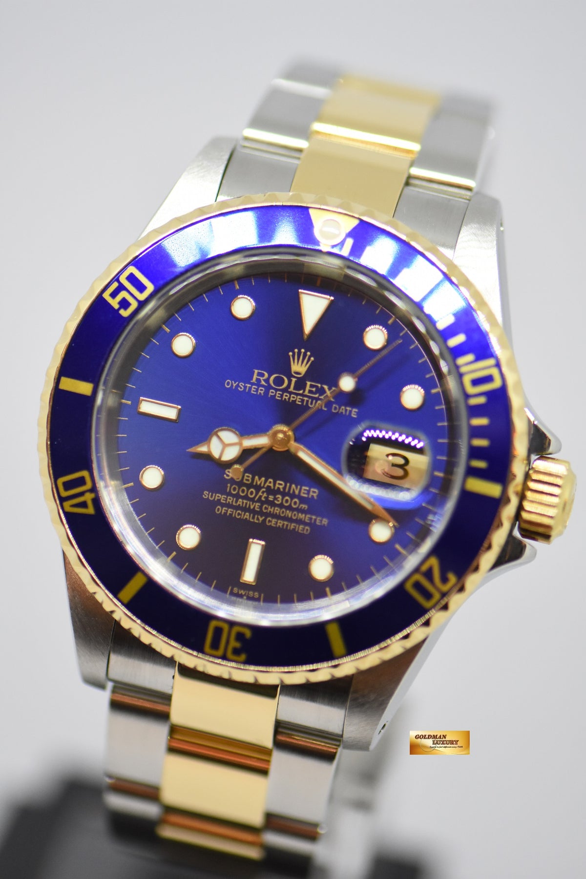 [SOLD] ROLEX OYSTER PERPETUAL SUBMARINER SUNBURST BLUE 40mm HALF-GOLD IN BRACELET 16613LB (MINT)