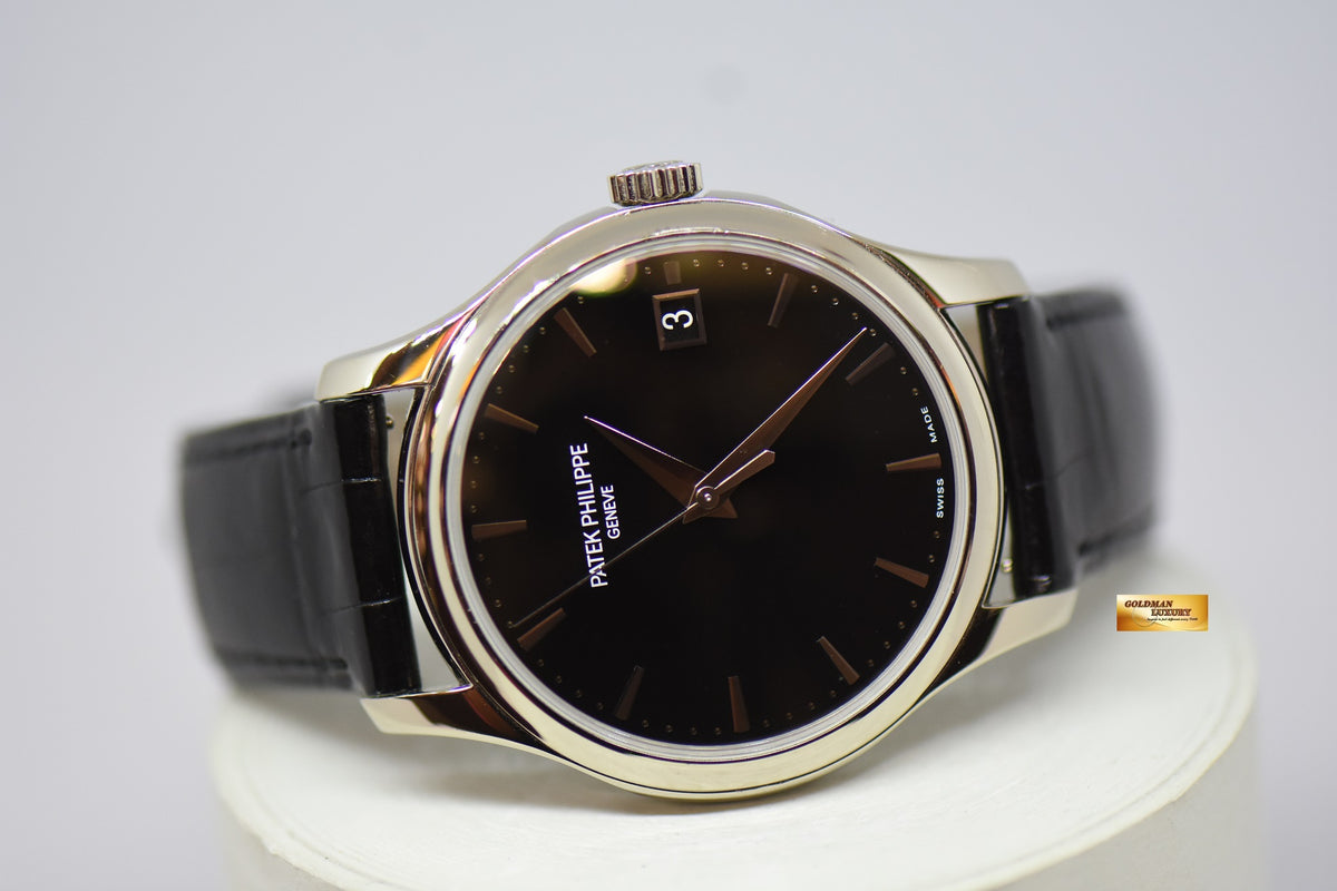[SOLD] PATEK PHILIPPE CALATRAVA DATE 39mm WHITE GOLD HINGED-BACK DUST COVER IN LEATHER STRAP AUTOMATIC 5227G (MINT)