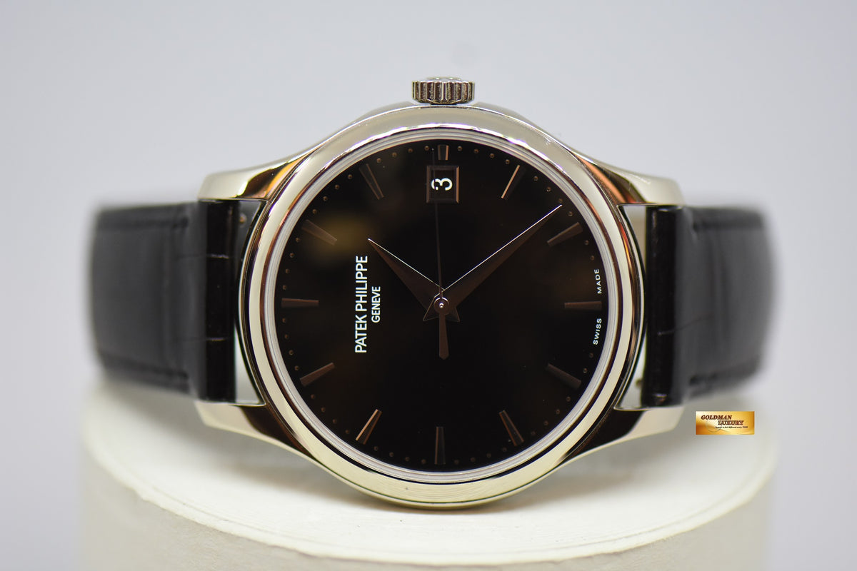 [SOLD] PATEK PHILIPPE CALATRAVA DATE 39mm WHITE GOLD HINGED-BACK DUST COVER IN LEATHER STRAP AUTOMATIC 5227G (MINT)