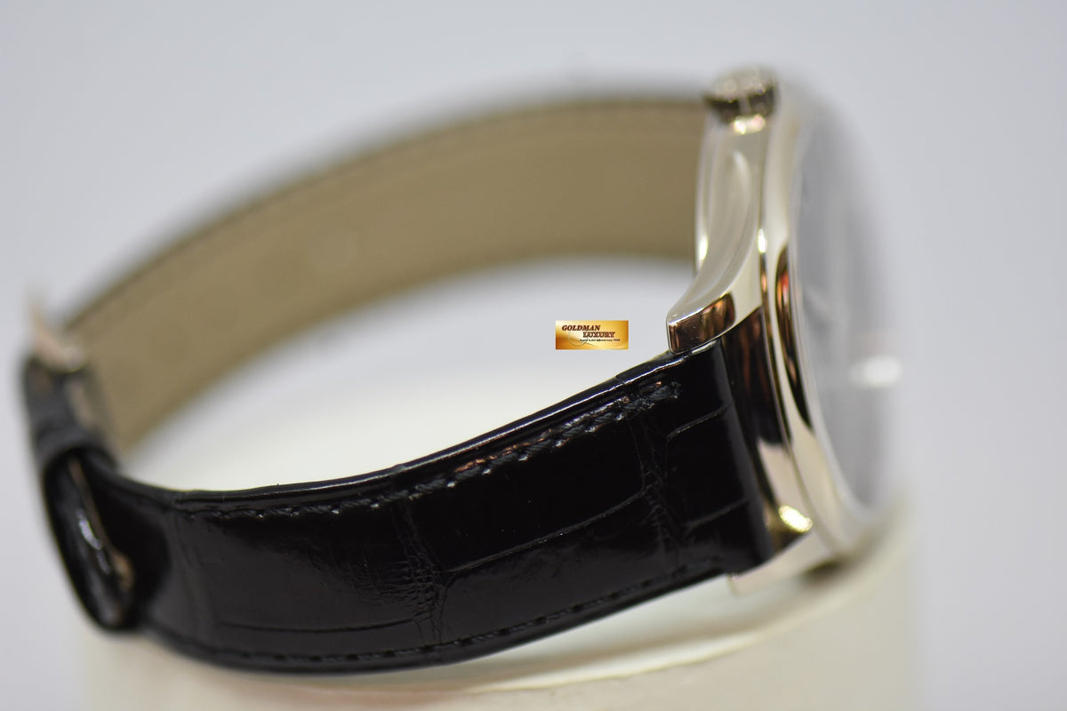 [SOLD] PATEK PHILIPPE CALATRAVA DATE 39mm WHITE GOLD HINGED-BACK DUST COVER IN LEATHER STRAP AUTOMATIC 5227G (MINT)