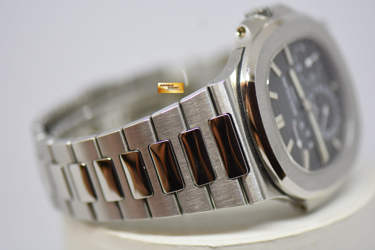 [SOLD] PATEK PHILIPPE NAUTILUS 40mm STAINLESS STEEL IN BRACELET POWER RESERVE MOONPHASE COMPLICATION AUTOMATIC 5712A-001 (MINT)