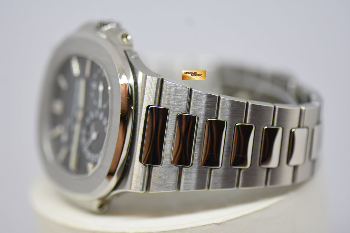 [SOLD] PATEK PHILIPPE NAUTILUS 40mm STAINLESS STEEL IN BRACELET POWER RESERVE MOONPHASE COMPLICATION AUTOMATIC 5712A-001 (MINT)