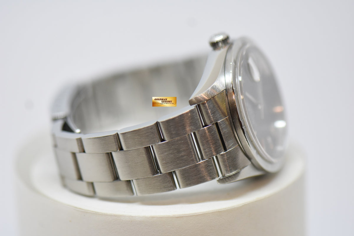 [SOLD] ROLEX OYSTER PERPETUAL DATE 34mm STEEL IN BRACELET GREY DIAL “STEEL ENGINE-TURNED” BEZEL 15210 (MINT)