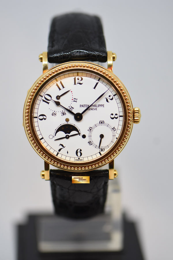 [SOLD] PATEK PHILIPPE CALATRAVA 35mm MOONPHASE POWER RESERVE 18K YELLOW GOLD OFFICERS CASE 5015J AUTOMATIC (MINT)